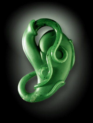 Complex jade carving of organic pod and tendril.