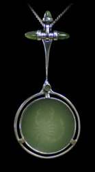 Carved Scorpio image inside jade disc.